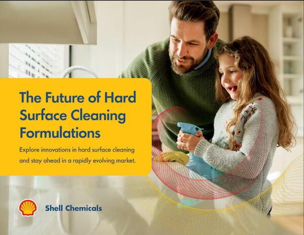 A man and child wiping a countertop.